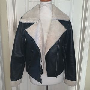 Black leather jacket with beige fur inside